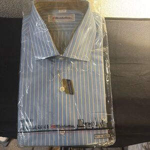 Man dress shirt inside the package and it’s never been opened.